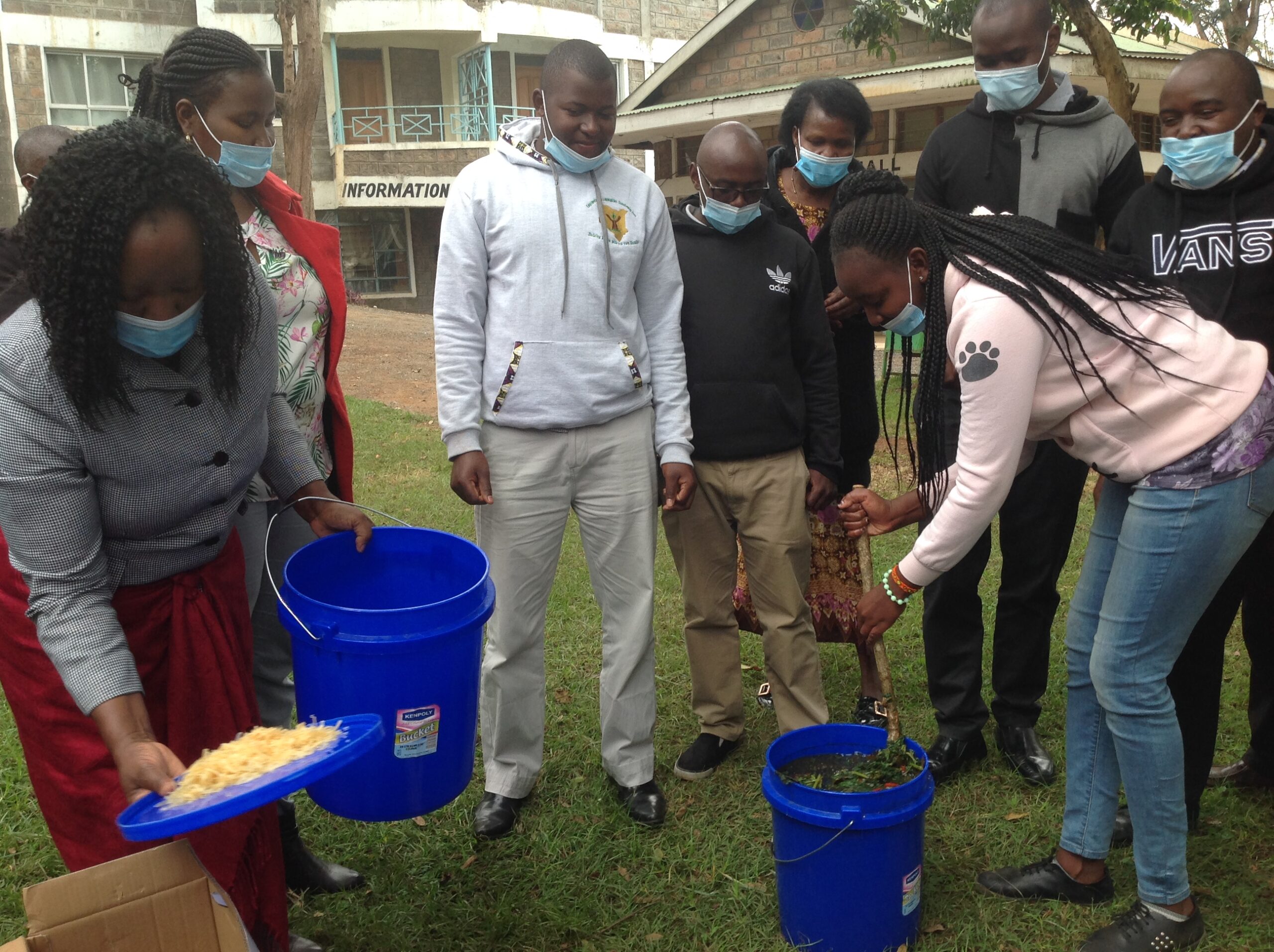 Participants of IPM workshop conducting a practical training on making botanical pesticides